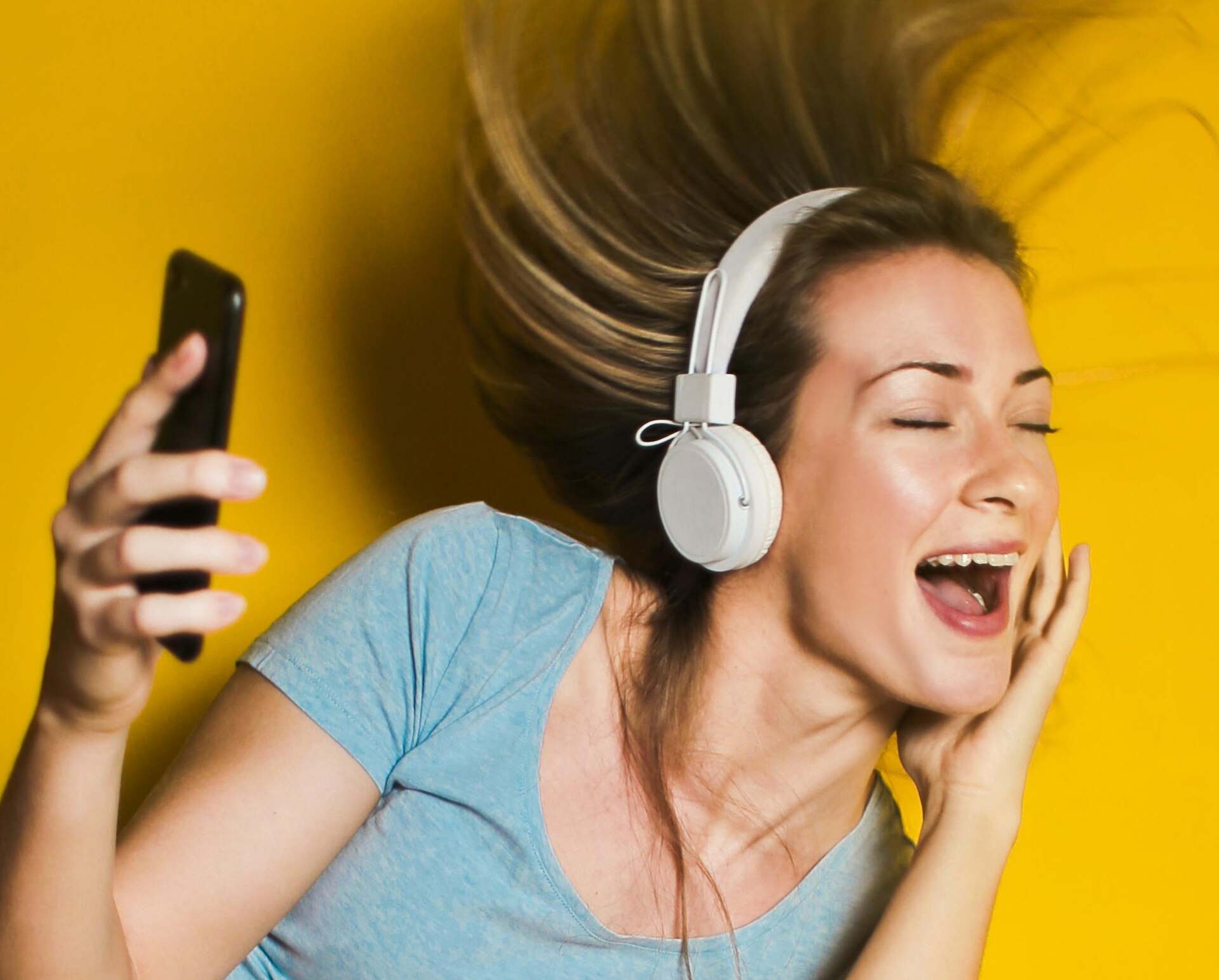 person listening headphones